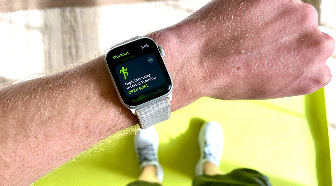 Smart watch open to a fitness app on a man's wrist