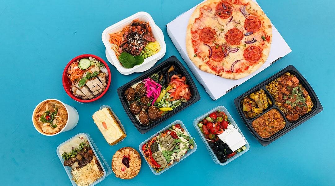 An assortment of boxed foods on a blue background